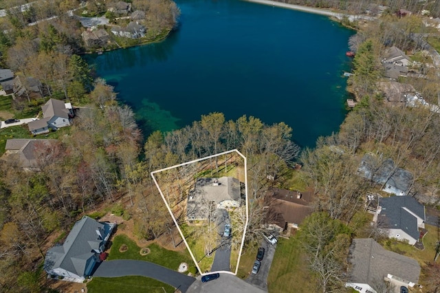 drone / aerial view featuring a water view and a residential view