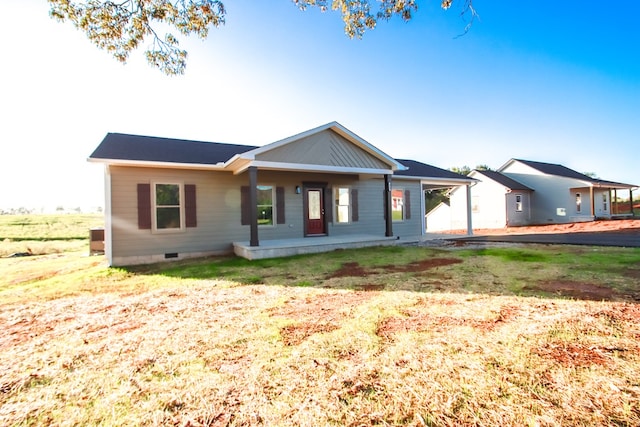 view of front of house featuring a porch, crawl space, and a front yard