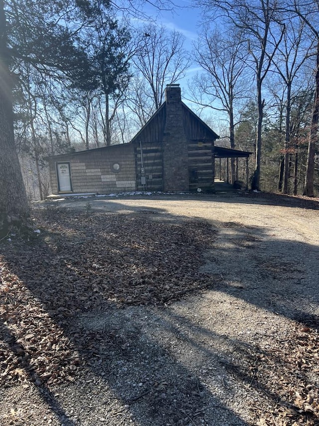 view of home's exterior with a chimney