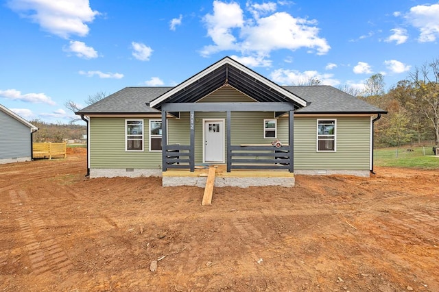 bungalow-style home featuring a shingled roof, crawl space, and covered porch