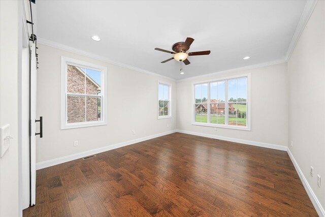 empty room featuring baseboards, visible vents, ceiling fan, ornamental molding, and dark wood-style flooring