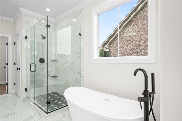 full bathroom with marble finish floor, crown molding, a freestanding bath, and a marble finish shower