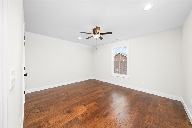 empty room with recessed lighting, visible vents, a ceiling fan, baseboards, and dark wood-style floors