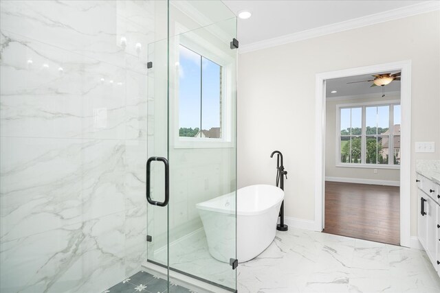 bathroom featuring marble finish floor, a marble finish shower, a soaking tub, ornamental molding, and vanity