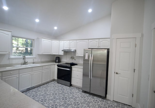 kitchen featuring light countertops, appliances with stainless steel finishes, a sink, and white cabinetry