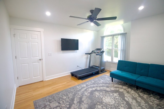 workout area featuring recessed lighting, wood finished floors, and baseboards