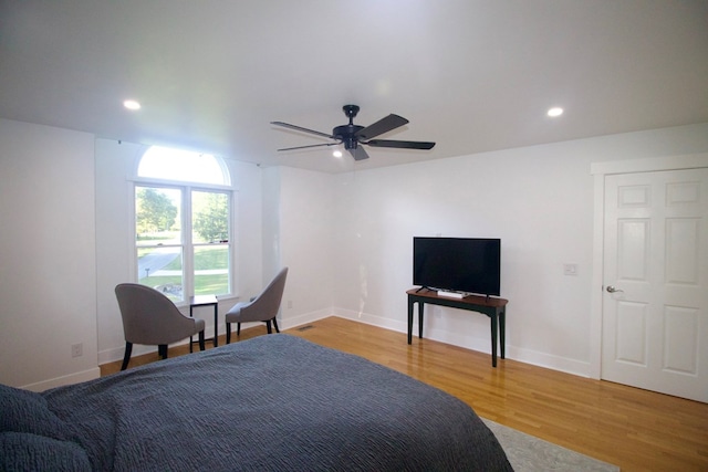 bedroom featuring light wood-type flooring, baseboards, and recessed lighting