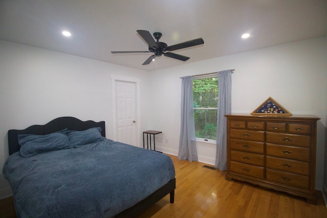 bedroom featuring a ceiling fan, light wood-type flooring, visible vents, and recessed lighting