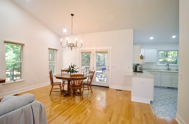 dining room featuring recessed lighting, visible vents, light wood-style floors, a chandelier, and baseboards