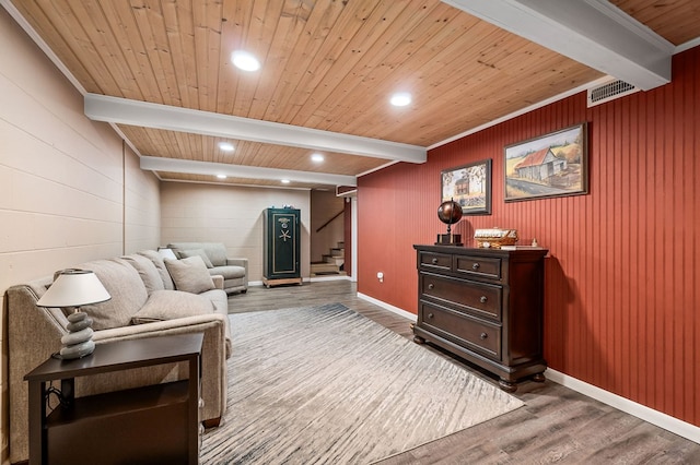 living area featuring visible vents, wood finished floors, wooden ceiling, beamed ceiling, and stairs