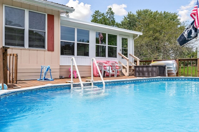 outdoor pool with a deck