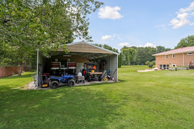 view of yard featuring a carport and driveway