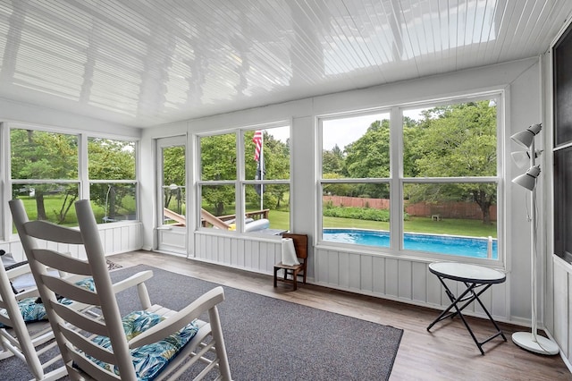 sunroom / solarium featuring plenty of natural light