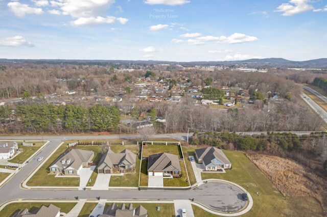 bird's eye view featuring a residential view and a mountain view