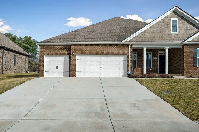 view of front of house featuring a garage, concrete driveway, brick siding, and a shingled roof