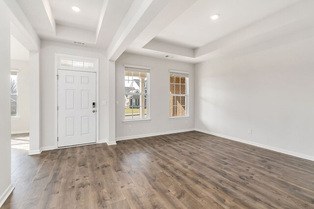 entryway featuring recessed lighting, visible vents, baseboards, a tray ceiling, and dark wood finished floors