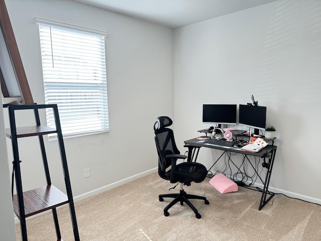 office space with light colored carpet and baseboards