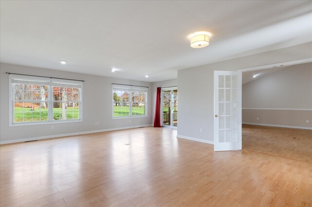 empty room featuring french doors, recessed lighting, visible vents, light wood-style floors, and baseboards