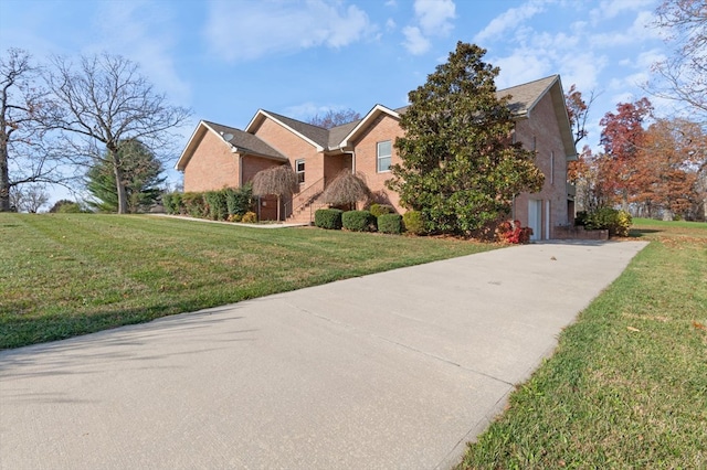 view of front of house featuring a front lawn, stairway, and brick siding