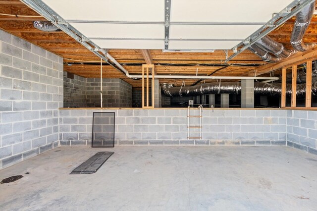 garage featuring concrete block wall