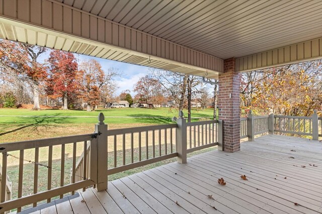 wooden terrace with a yard