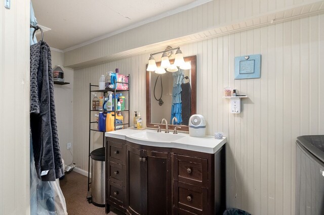 bathroom featuring ornamental molding and vanity