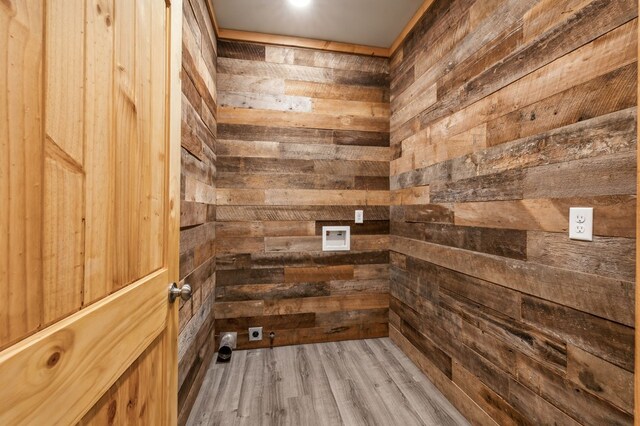 interior space featuring wooden walls and wood finished floors