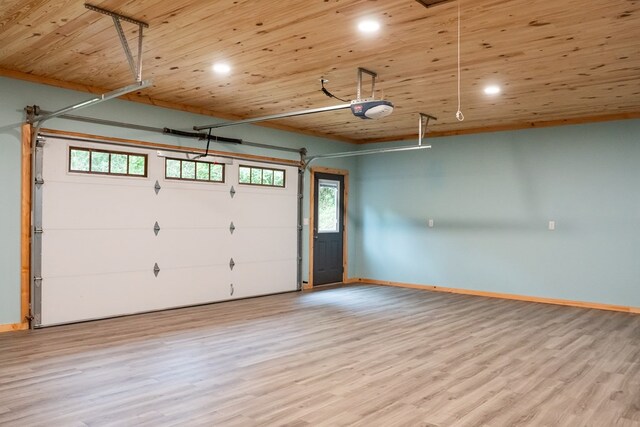 garage with a garage door opener, recessed lighting, wood ceiling, and baseboards