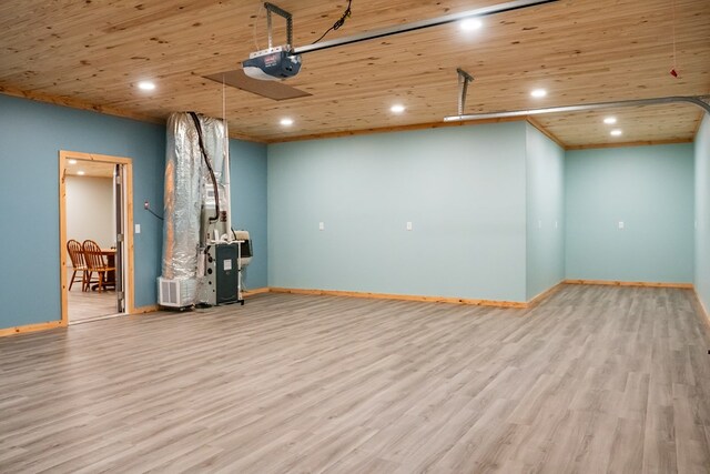 basement with light wood-type flooring, wooden ceiling, baseboards, and recessed lighting