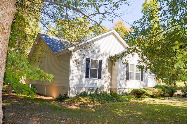 view of home's exterior featuring a garage and crawl space