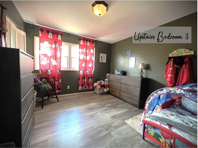 bedroom with wood finished floors