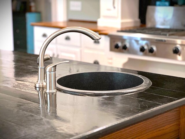 details featuring dark countertops and stainless steel gas cooktop