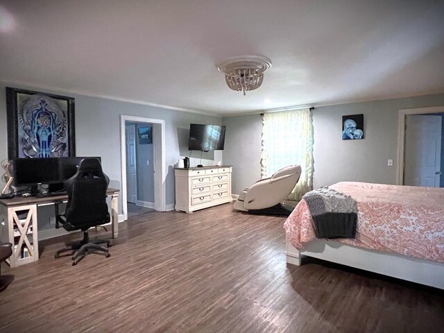 bedroom featuring dark wood-style flooring and baseboards