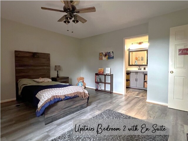 bedroom with baseboards, ensuite bath, ceiling fan, wood finished floors, and a sink