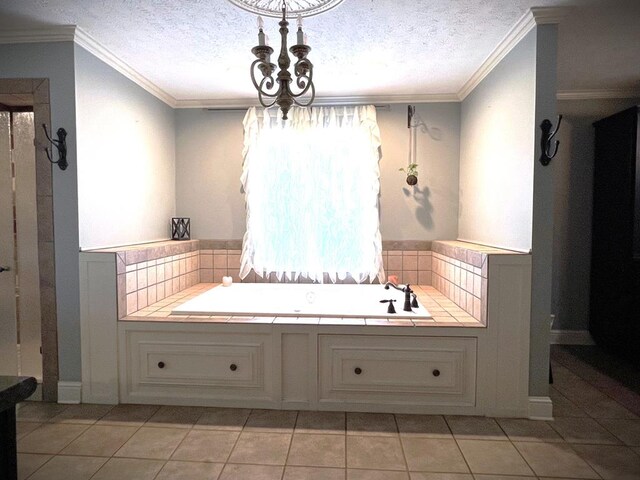 full bathroom featuring ornamental molding, tile patterned flooring, a garden tub, and a textured ceiling