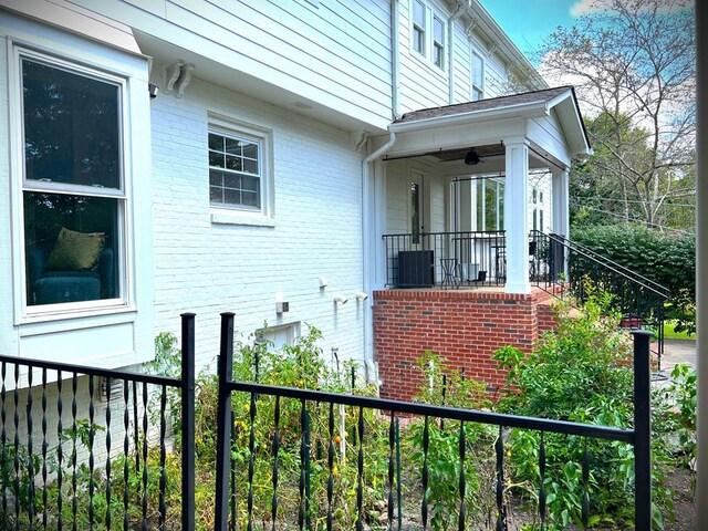 view of home's exterior featuring fence and brick siding