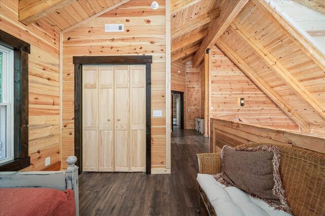 bedroom featuring lofted ceiling with beams, wood walls, wood ceiling, and dark wood-style floors