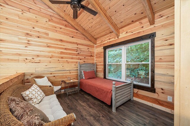 bedroom featuring vaulted ceiling with beams, ceiling fan, wood walls, wood ceiling, and dark wood finished floors