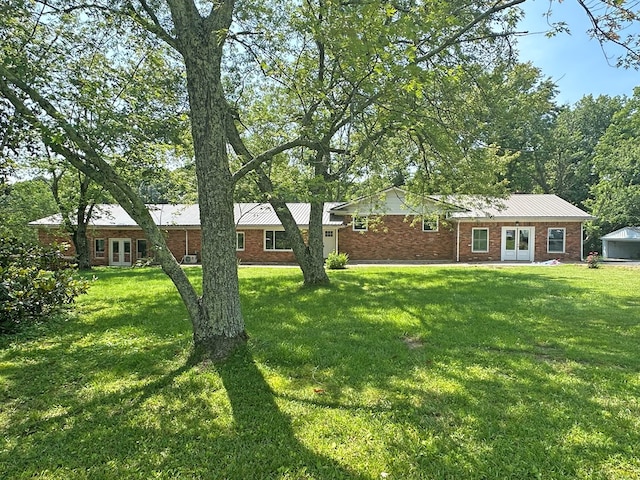 view of yard featuring french doors