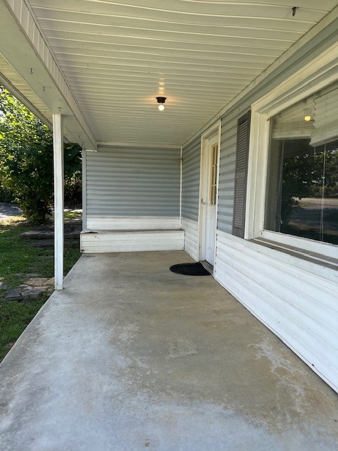 view of patio with an attached carport