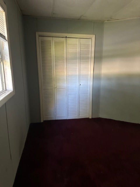 unfurnished bedroom with a closet