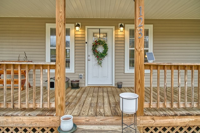 doorway to property featuring covered porch