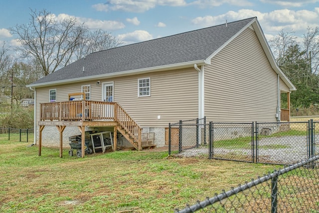 rear view of property featuring stairway, a gate, fence, a deck, and a yard