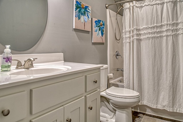 full bathroom with shower / tub combo with curtain, vanity, and toilet