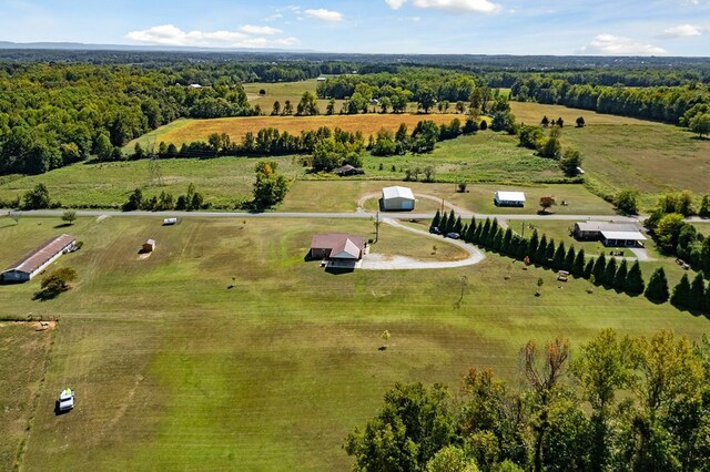 birds eye view of property with a rural view