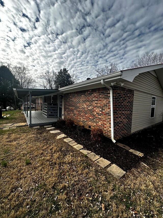 view of side of property with brick siding