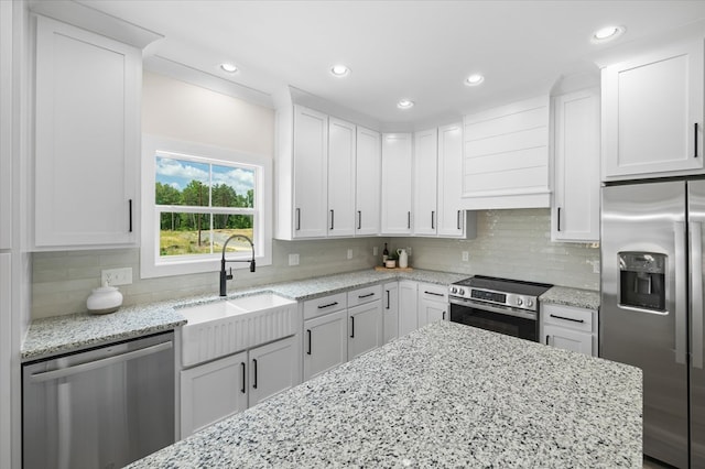 kitchen featuring white cabinetry and appliances with stainless steel finishes