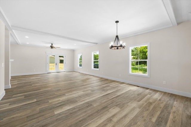 spare room with french doors, baseboards, and wood finished floors