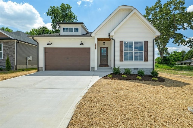 view of front of house featuring crawl space, driveway, and an attached garage