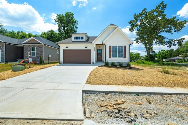 ranch-style home featuring a garage and concrete driveway